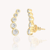 Graduated Five Diamond Bezel Curve Stud Earrings in Yellow Gold