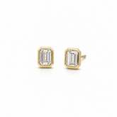 bezel setting emerald cut diamond earrings on white background.