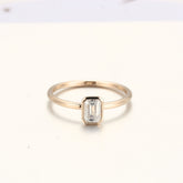 gold-bezel-emerald-diamond-ring