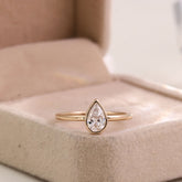 pear shape diamond bezel ring