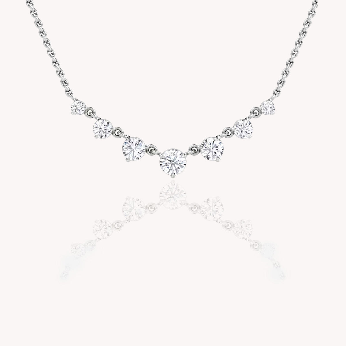Seven Round Diamond Graduated Necklace In White Gold