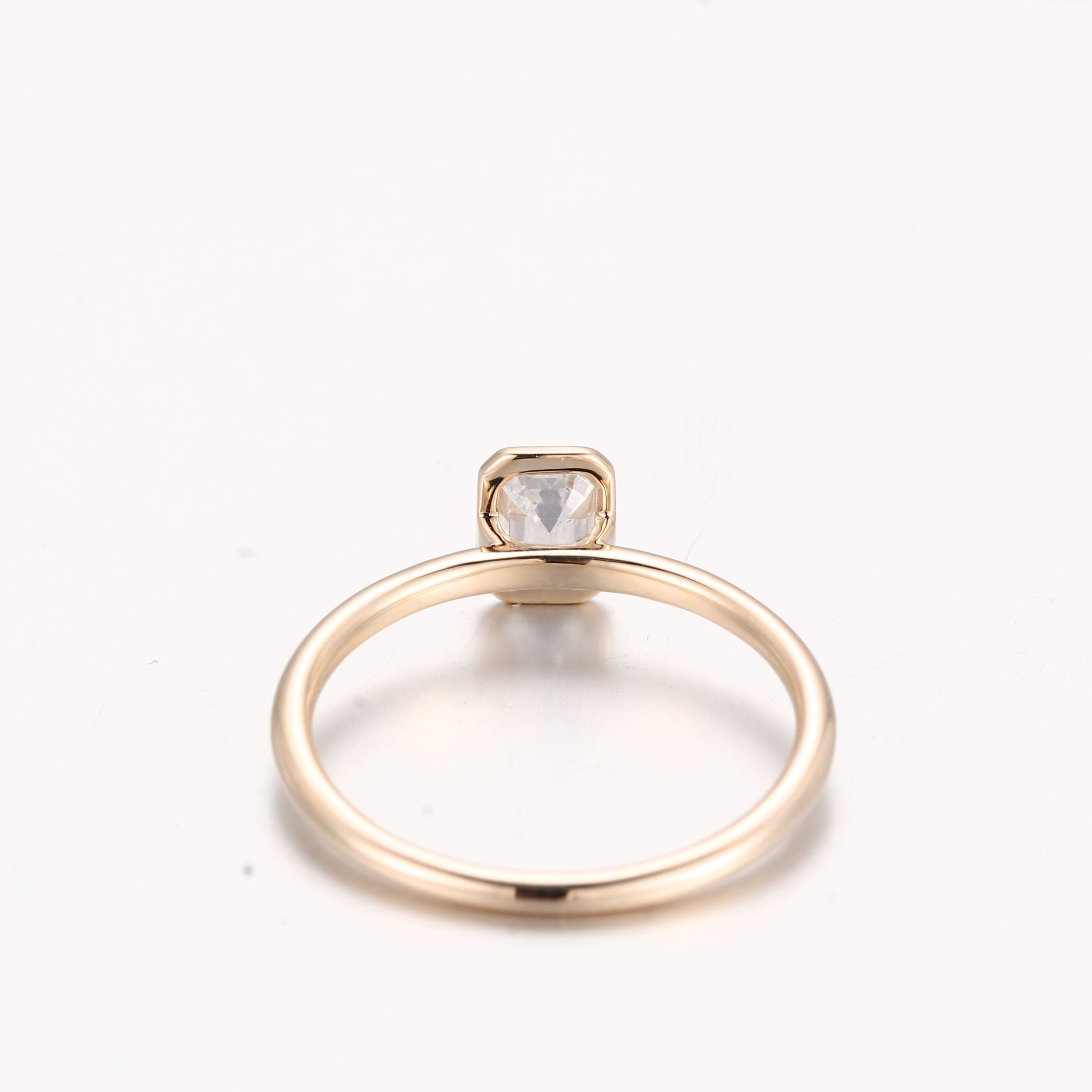 gold-bezel-emerald-diamond-ring