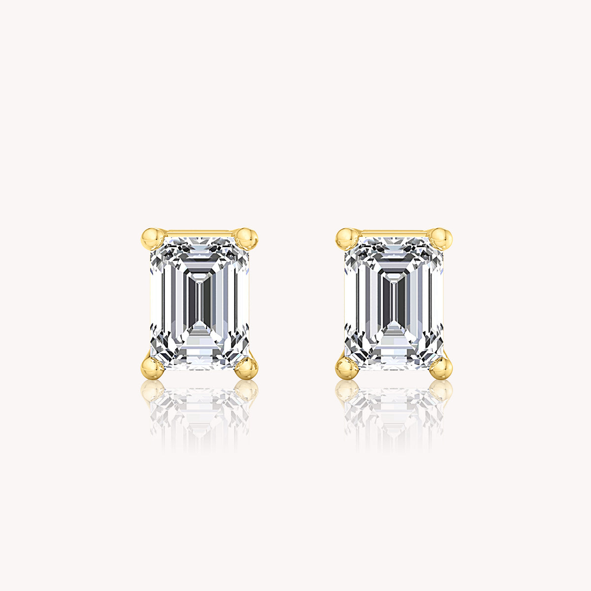 Solitaire Emerald Cut Earrings In White Gold