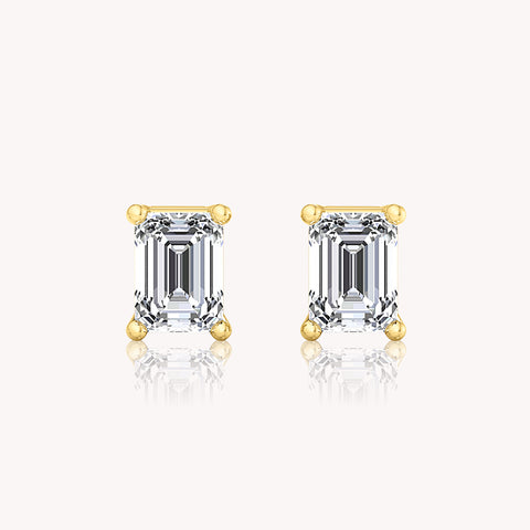 Solitaire Emerald Cut Earrings In White Gold